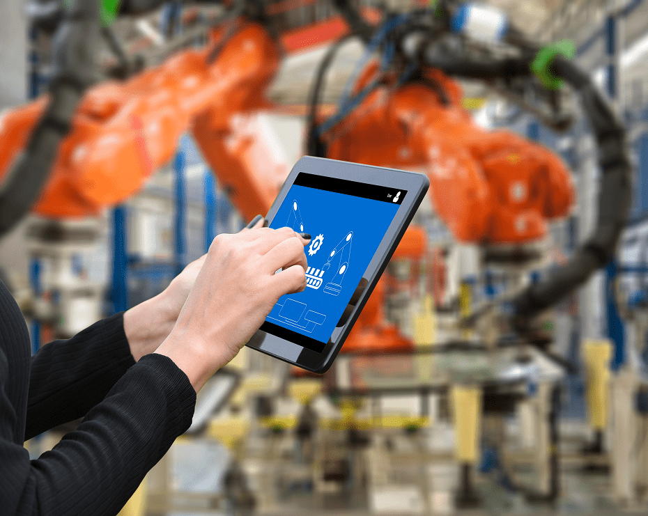 Person using tablet in industrial setting